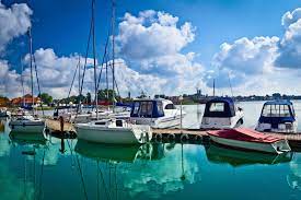 Boat dock boat dock water sea ship ocean river blue summer boats sky sail travel holiday coast nature transportation evening horizon sunset vacation sport vessel sailing old mountain night beach. Boat Dock Bytelion