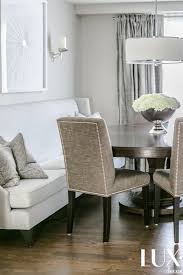 Beautiful Round Dining Table With A High Back Sofa And Classic Lux Hydrangeas In A Piedestal Silver Bowl Designed By Lux Decor Decor Round Dining Table Dining