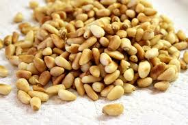 Mound couscous on a platter. Pine Nuts Nutrition Facts Health Benefits Substitutes Pictures