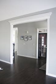 We pretend that stained wood floors never go out of style, but they're just as influenced by design trends as the colors on your walls or the drapes in your living room. Gray Owl Bm Living Into Entry Living Room Wood Floor Paint Colors For Living Room Home