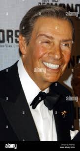 FILE ** In this Sept. 4, 2004, file photo, Ohio State coach Jim Tressel,  left, and then-Cincinnati coach Mark Dantonio meet after Ohio State's 27-6  win in an NCAA college football