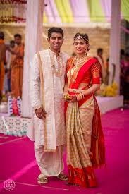Beautiful Couple Bride In Checkered Kanchipuram Saree With Bright Red Border And Gold Jewe Wedding Outfits For Groom Indian Wedding Outfits South Indian Bride