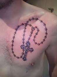 Of course, you can always elect to go with the more traditional route with hands praying too. 52 Rosary Tattoos For Men