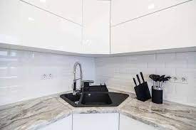The entire cabinet front is designed with a single glass. Lacquer Kitchen Cabinets Pros And Cons Designing Idea