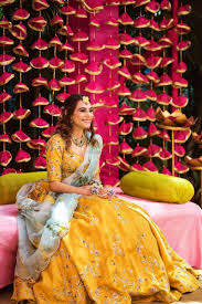 A Bride In A Yellow Mehendi Outfit Mehndi Wedding Dresses For Girls Mehendi Outfits Muslim Wedding Dresses