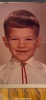 Who else remembers rocking the bolo tie in Kindergarten at DA? Note my lack  of teeth here. It resulted in my Dad nicknaming me Wolf. A nickname that  stuck through the years,