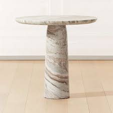 Sierra textured black frame with ebony faux marble top round counter table, faux marble with textured black steel base. Marble Dining Tables Cb2