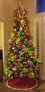 Grinch christmas decorations whoville christmas beautiful christmas trees colorful christmas tree noel christmas green christmas christmas wreaths christmas crafts christmas ideas. Red And Green Whimsical Christmas Tree Whimsical Christmas Decor Whimsical Christmas Trees Green Christmas Tree Decorations