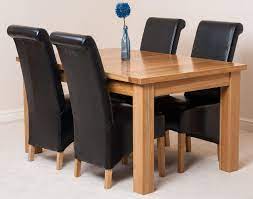 There are many types of quality matching oak dining tables and chairs to choose from, but the easiest way to narrow your search on ebay is to decide between a contemporary oak dining set, antique oak dining set or country oak dining set. Seattle Extending Oak Dining Table With 4 Black Lola Dining Chairs