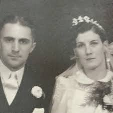 I found this picture of Mom (Mary Margarite Caissie Arsenault of Egmont  Bay) and Dad (Augustine Alfred Arsenault of Bedeque) in 1997 when they went  to visit the gravesite of Dad's pal,