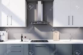 Beautiful blue kitchen cabinet ideas the spruce blue is a notice me hueathat s why we re obsessed with kitchen cabinets in the ultra popular color from 27 blue kitchen ideas pictures of decor paint cabinet a very modern kitchen with a masculine and futuristic feel the kitchen cabinets are bent or. Interior Of Modern Kitchen With Grey Walls Blue Countertops Stock Photo Picture And Royalty Free Image Image 139210748