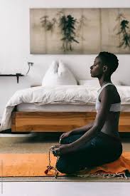 Profile Of An Attractive Black Woman Meditating With Eyes Closed In A Beautiful Bedroom She Is Using A Mala For He Black Girl Yoga Meditation Meditation Space
