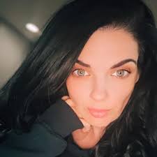 Why is my ball python refusing to eat and cuddling its food?