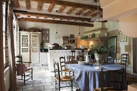 Find the perfect home furnishings at hayneedle, where you can buy online while you explore our room designs and curated looks for tips, ideas & inspiration to help you along the way. Rustic Kitchen Dining Room With Wooden Table Counter With Bar Stools In Background Photograph By Christophe Madamour