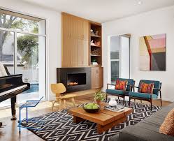 A slim tabletop with slender legs and an oval silhouette is simplicity at its most charming. Create Your Vintage Mid Century Modern Living Room