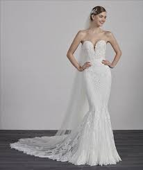 The sheath type of gown elongates your frames and gives modern vibes. Pronovias Wedding Dress Designer Archive Bridal