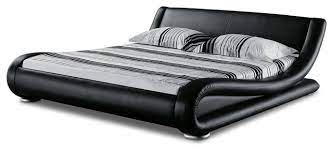 Constructed of solid rubberwood frame, both the headboard and footboard of the platform bed are upholstered in black faux leather with white stitching separating the leather in to a rectangular design. Modern Black Leather Platform Marlo Bed Contemporary Platform Beds By Zuri Furniture Houzz