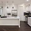With the contrast between the different types of material in the cabinets and countertops, any kitchen can be transformed with a deep wooden color in the floors. 1