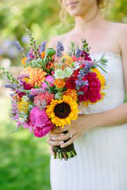 Hyacinths, chrysanthemums, tulips, sunflowers, phalaenopsis orchids, cymbidium orchids. Wedding Ideas Planning Inspiration Colorful Wedding Bouquet Sunflower Wedding Bouquet Bright Wedding Flowers