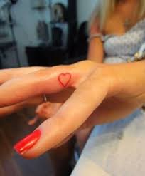 Pin By Selena Ayala On Tattoos Heart Tattoo On Finger Red Heart Tattoos Finger Tattoo For Women