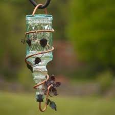 Attach a piece of pvc pipe to the neck of the glass jug. Making A Hummingbird Feeder Thriftyfun