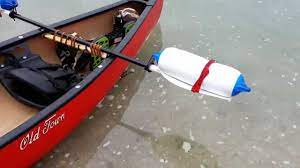 How To Make A Canoe Outrigger System From Boat Fenders And A Paddle Build Your Own Boat Canoe Canoe Stabilizer
