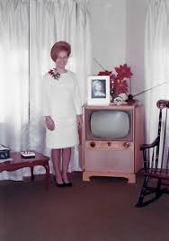 1960s living room with a classic television set.