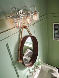 The brass light on the wall is a reproduction of an antique fixture typically seen on ships. Just Diy Decor On Twitter 16 Beach Themed Bathroom Ideas With Beach Themed Bathroom Accessories Https T Co Rjh2eibxrz Homedecor Home Diy Homedecorideas Beachthemedbathroomideas Beachthemed Bathroomideas Bathroom Https T Co Rr07mdho0z