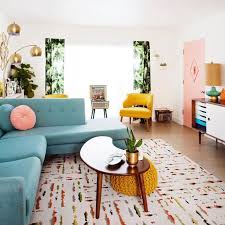 A Colorful Living Room With Pink Yellow Blue Green And Lots Of Prints And Te Living Room Decor Modern Mid Century Modern Living Room Mid Century Living Room