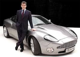 Pierce Brosnan Posing With An Aston Martin Vanquish James Bond Cars Bond Cars Aston Martin Vanquish