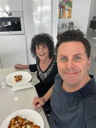 Enjoying homemade pizza with my mom