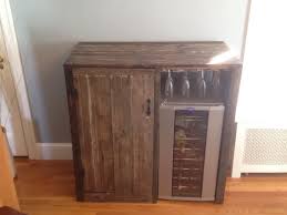 Artistically restored has a variety of farm house styled cabinets from vertical to horizontal ones. My First Pallet Project Rustic Liquor Cabinet With Built In Wine Fridge Viola Wine Fridge Cabinet Wine Fridge Dining Room Credenza