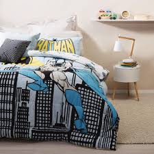 The batman queen comforter set with 2 pillow cases has an 86'' by 86'' comforter with one giant symbol while the two pillow cases measure 20'' by 30'' and features a whole ton of symbols. Batman Comforter Set City Blue Grey King Single The Warehouse