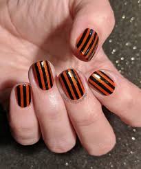 Most popular nail art design ideas 2020. Black And Orange Striped Nails 15 Halloween Nail Art Ideas You Can Wear All October Page 4