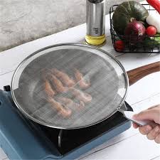To keep the grease, oil, or sauce in the pan itself, make use of splatter screen and protect your stovetop before it gets impossible to clean. 1x Stainless Steel Cover Lid Oil Proofing Frying Pan Splatter Screen Spill P Xg Home Garden Kitchen Tools Gadgets