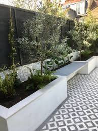 Huge collection, amazing choice, 100+ million high quality, affordable rf and rm images. Paint It White White Rendered Walls And White Fencing Courtyard Gardens Design Back Garden Design Outdoor Gardens Design