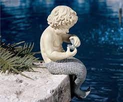 Mermaids were often depicted as saving sailors from the sea. Amazon Com 16 Little Merman Sculpture Home Garden Poolside Statue Outdoor Statues Patio Lawn Garden Mermaid Statues Mermaid Sculpture Statue