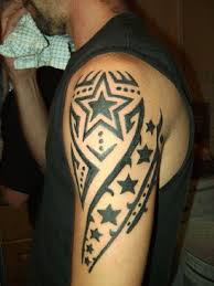 Colorful three star tattoos on arm for men. 66 Tribal Star Tattoos Designs With Meanings
