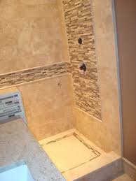 This cozy bathroom from cathie hong does just that, where the patterned floor tile add visual interest, and the large subway tile on the walls form a uniform setting for rest of the bathroom's decor. Ceramic Tile Ideas Whaciendobuenasmigas