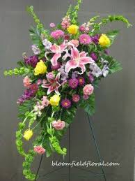 Crescent Shaped Standing Funeral Spray Funeralflowers Stargazers Funeral Flower Arrangements Casket Flowers Beautiful Flower Arrangements