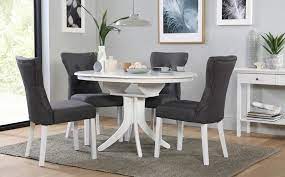 These often very stylish looking pieces of furniture allow you to have a feast for the whole neighbourhood or, when in their smallest state, just have a eye pleasing modest sized table. Hudson Round White Extending Dining Table With 4 Bewley Slate Chairs Only 399 99 Furn Small Dining Room Table Round Dining Room White Extending Dining Table