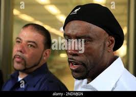 Cephus Johnson, Oscar Grant's uncle, right, and Jack Bryson, father of the  two friends of late Oscar Grant, left, talk to the media, after a pretrial  hearing for Johannes Mehserle, a former Bay Area Rapid Transit officer  charged with murder in the shooting death ...