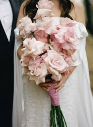 An unusual choice for a bridal bouquet, the pomander is a sphere or ball of flowers carried by a loop of ribbon. 20 Pretty Pink Wedding Bouquets For Every Style Bride