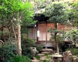 Hình ảnh về zen garden with stone planters and plants