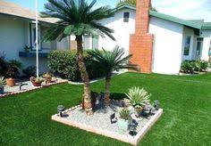 It loves a bright spot, but be sure to avoid bright sun rays on its fronds, says mast. 21 Palm Tree Ideas Front Yard Landscaping Palm Trees Landscaping Front Yard