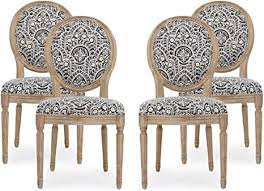 These dark elements are complemented by the white dining chairs, area rug, and the framed artworks of the walls. Amazon Com Christopher Knight Home Hulda French Country Fabric Dining Chairs Set Of 4 Black White Pattern Natural Chairs