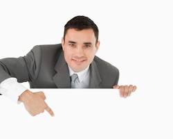 Image of person pointing to a sign