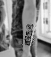 Typically, women decorate the letter with more girly symbols like flowers, butterfly etc. 101 Kids Name Tattoo Ideas Incl Initials Symbols And Dates Names Tattoos For Men Kid Name Tattoo Tattoos With Kids Names