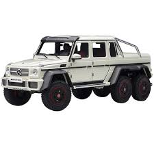 Having set the standards for luxury automobiles for almost a century, mercedes never rest on their laurels and continue to produce astounding vehicles, and with each new model launch, a new. Mercedes Benz G63 Amg 6x6 Designo Diamond White With Carbon Accents 1 18 Model Car By Autoart Target