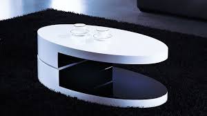This coffee table features a clear modern design that has two oval tempered glasses that can be rotated, definitely gives a different look on rooms. High Gloss White And Black Oval Coffee Table Worcester Massachusetts Ah8435